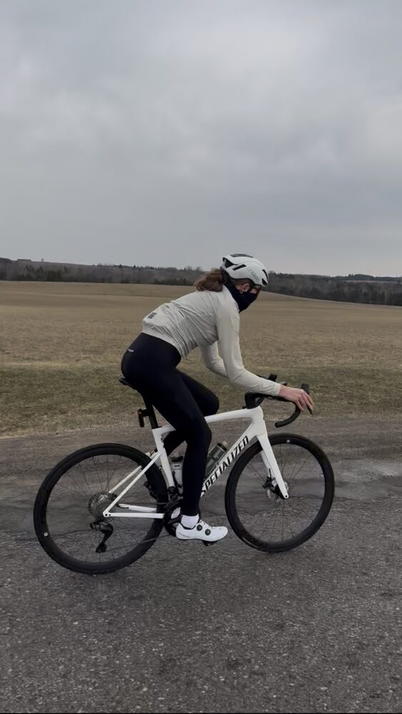 Rider climbing a farm road on the Brooklin to Port Perry loop
