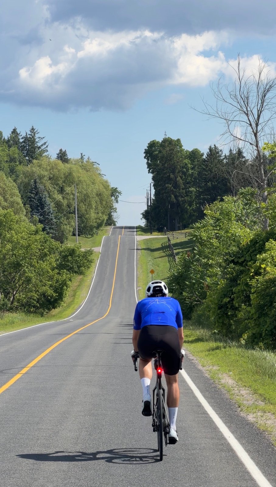 Riding up a rolling country road through the Caledon hills