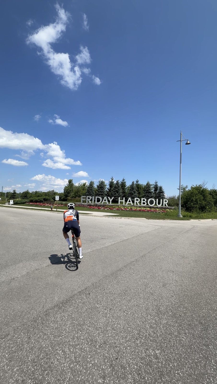 Riding toward the Friday Harbour sign on the approach to the resort