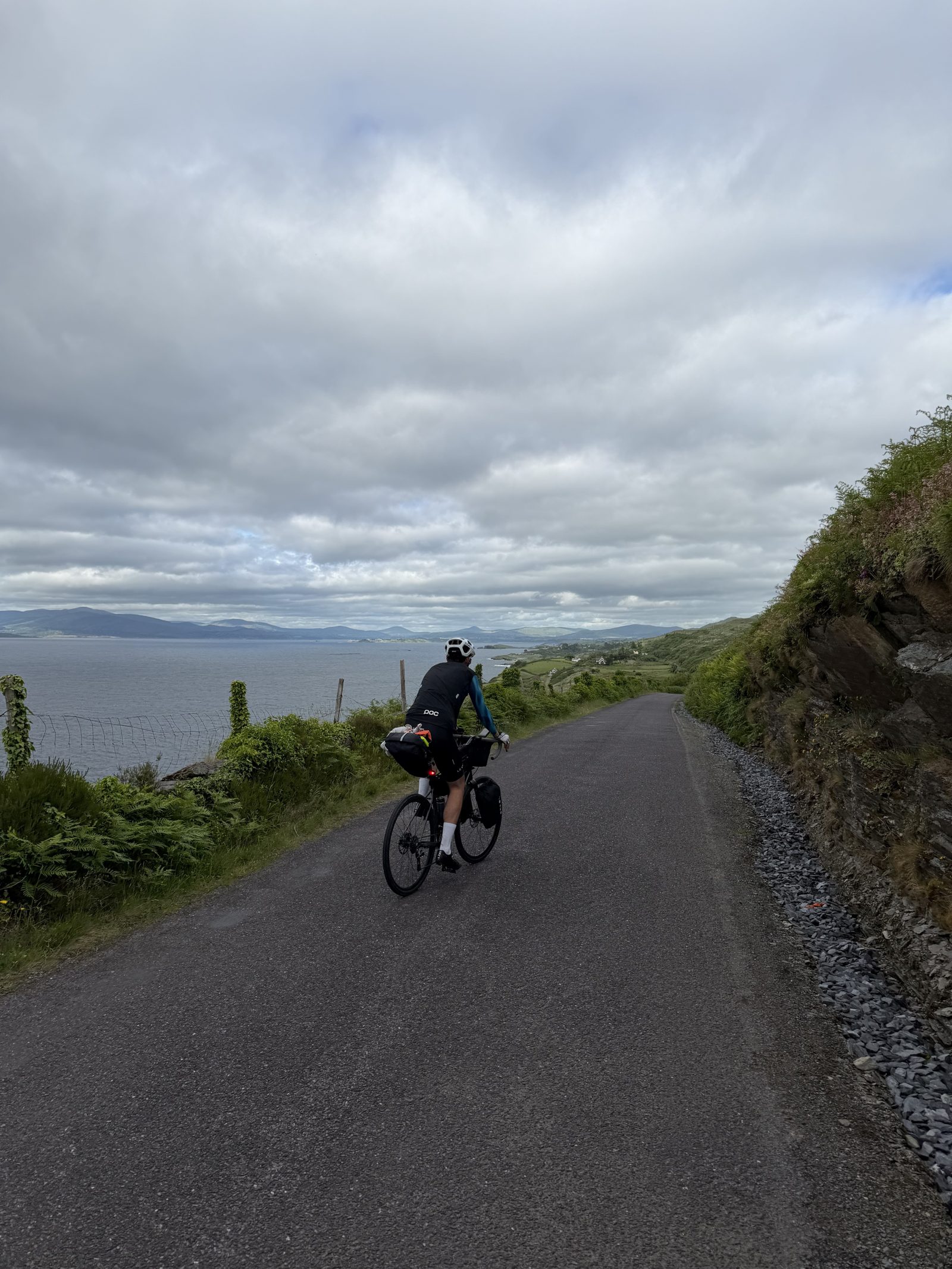 Francis riding a narrow coastal lane on Sheep's Head with the open sea to his left