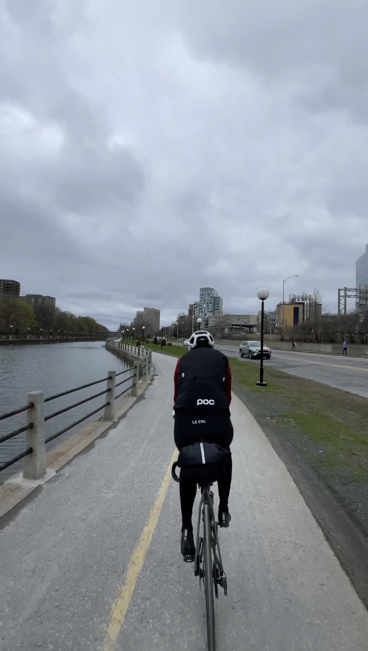 Riding the Rideau Canal pathway with the downtown Ottawa skyline ahead