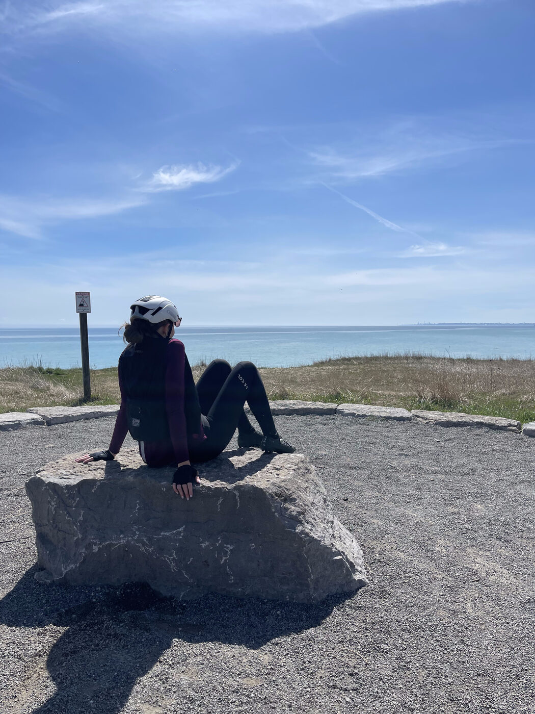 Bailey resting at a lakeshore lookout over Lake Ontario on day one