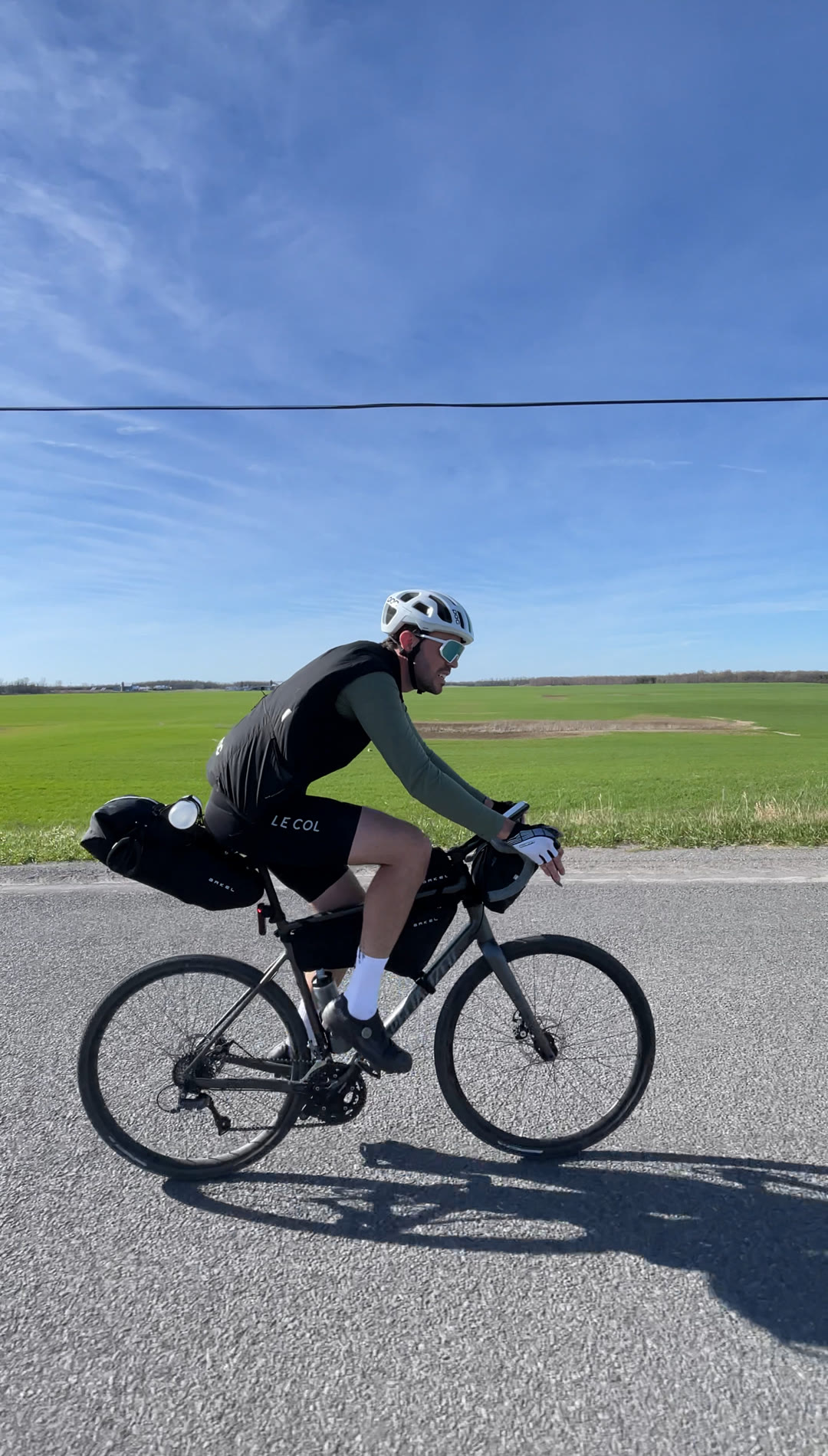 Riding past open farm fields on the way into Picton