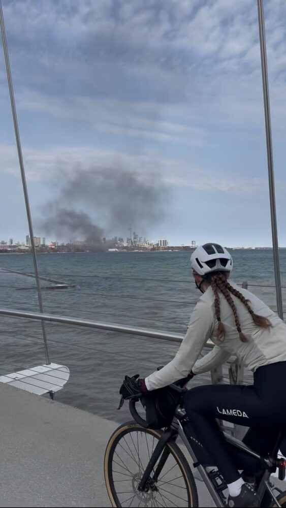 Riding the Lake Ontario waterfront with the Toronto skyline behind